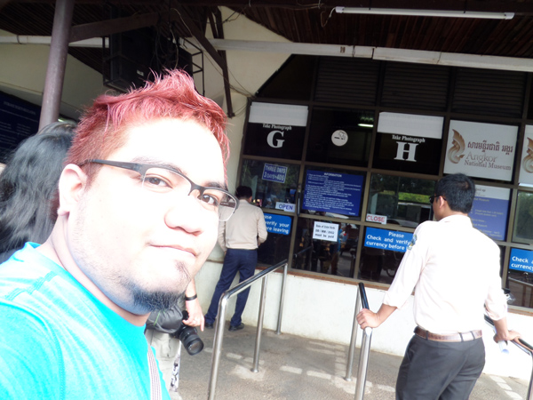 Ethan at Siem Reap's temple ticketing booth