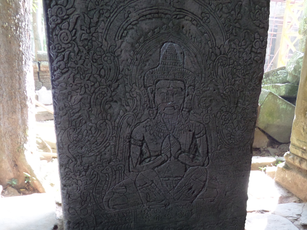 Buddha to Hindu god etching in one of the columns at Ta Prohm, Cambodia