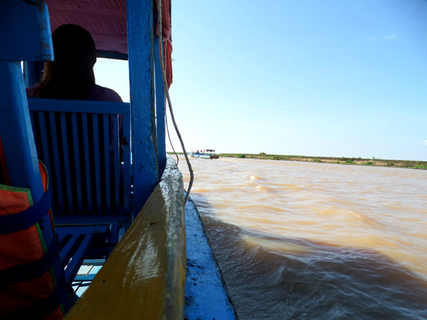 aboard a tourist boat on Tonle Sap Lake, Cambodia