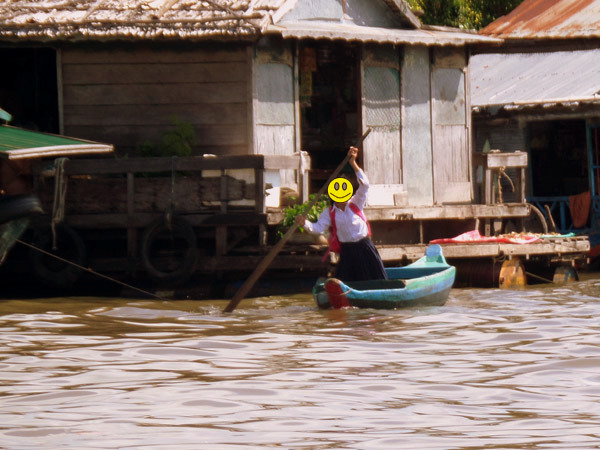 a student at Tonle Sap, Cambodia