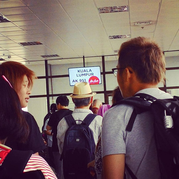 passengers boarding AirAsia flight to Kuala Lumpur