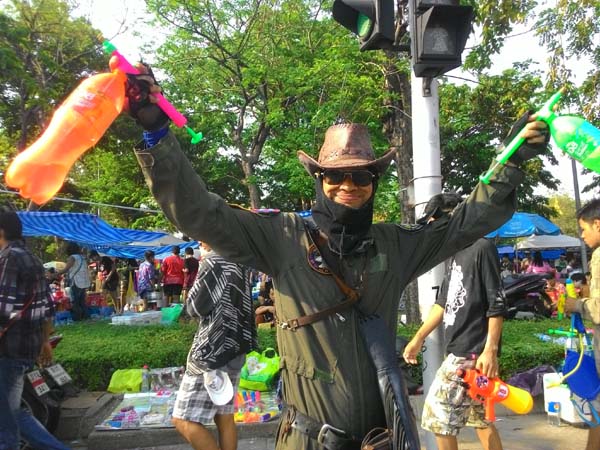 Uniformed guy enjoying Songkran outside Khao San Road