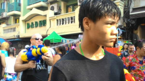 Guy with watergun during Songkran on Khao San Road, Bangkok